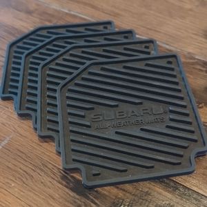 Genuine Subaru Car Mat Rubber Coasters. Set of Four. Black.